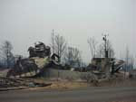 Geoscience Australia's Satellite Laser Ranging facility at Mt Stromlo destroyed by firestorm on 18 January 2003.
