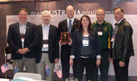 Figure 1. The Team Australia Geothermal exhibitors, including Dr Andy Barnicoat and Dr Anthony Budd of Geoscience Australia (2nd and 3rd from left), following the presentation of the 'Best in Show' award.   