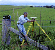 Man operating a GPS receiver in the field