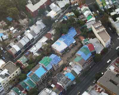 Damaged homes in Sydney following the hailstorm in 1999