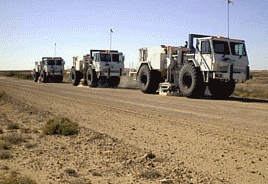 Image of seismic thumper trucks in the field