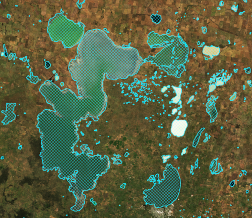 Graphic blue hatched overlay showing waterbody shapes on brown satellite image.