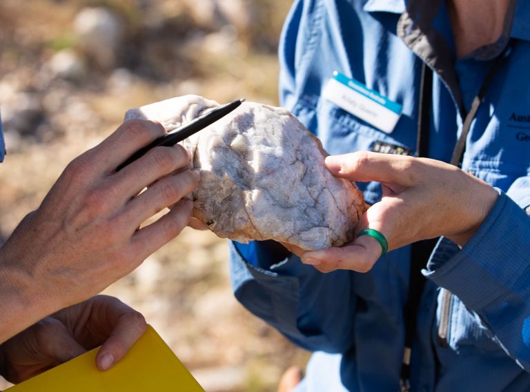 Geoscientists inspecting quartz