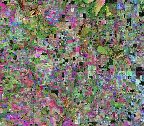 Abstract image of colourful crops as seen from satelite